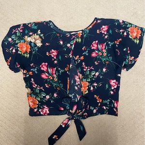 Blue floral shirt.